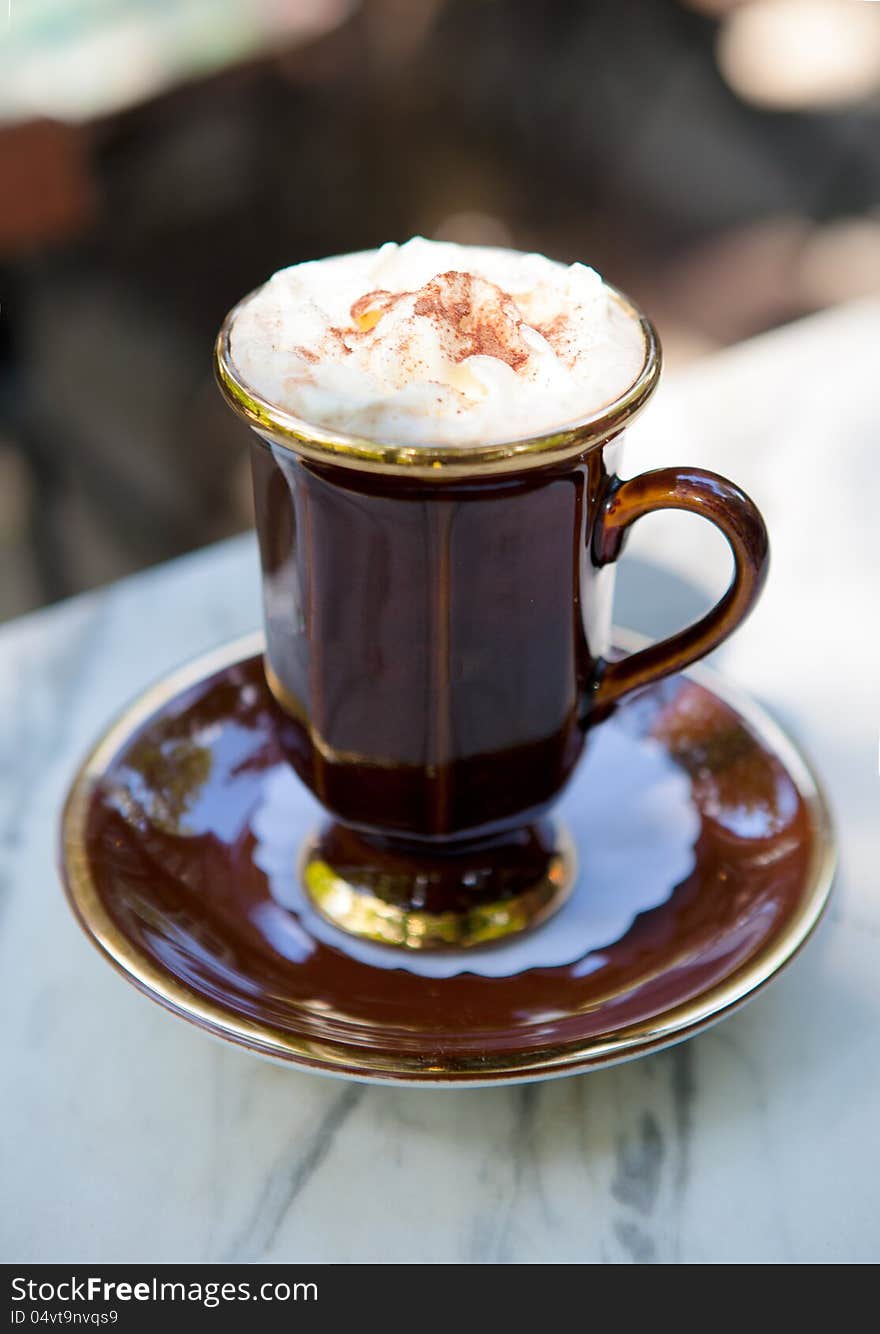 Cup of coffee on a table outdoors