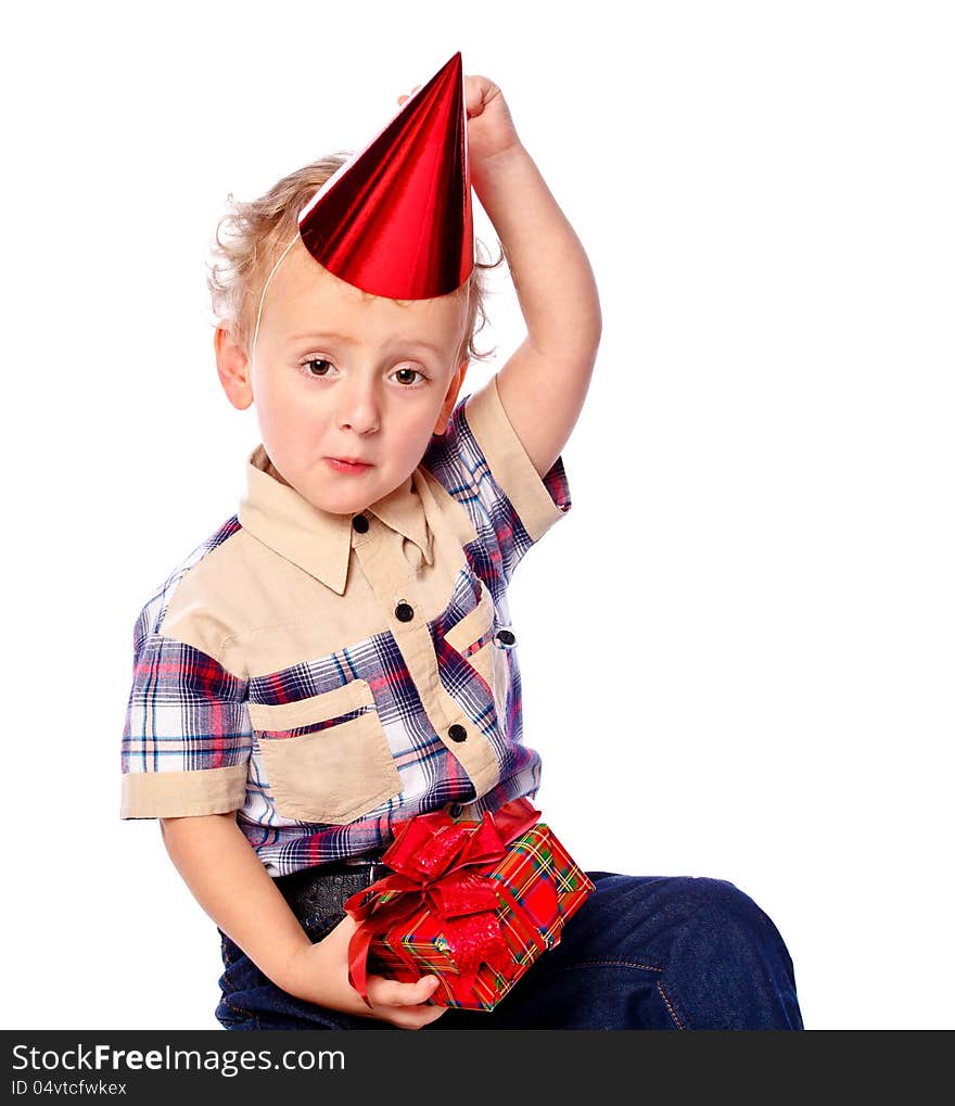 Portrait of a little boy holding a gift, isolated