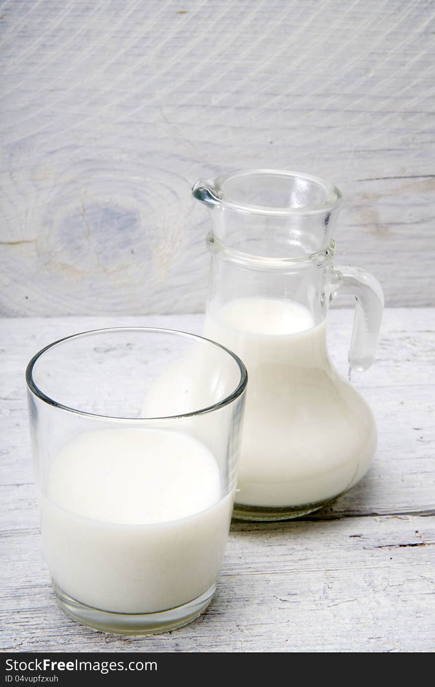 Jug and glass with milk and sugars