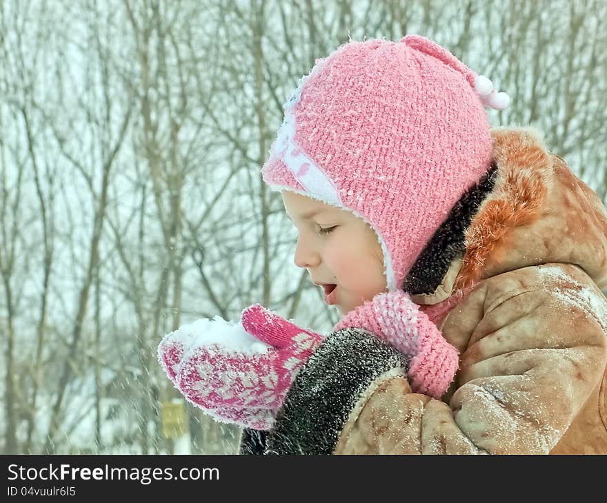 Sweet girl with snow in hands. Sweet girl with snow in hands