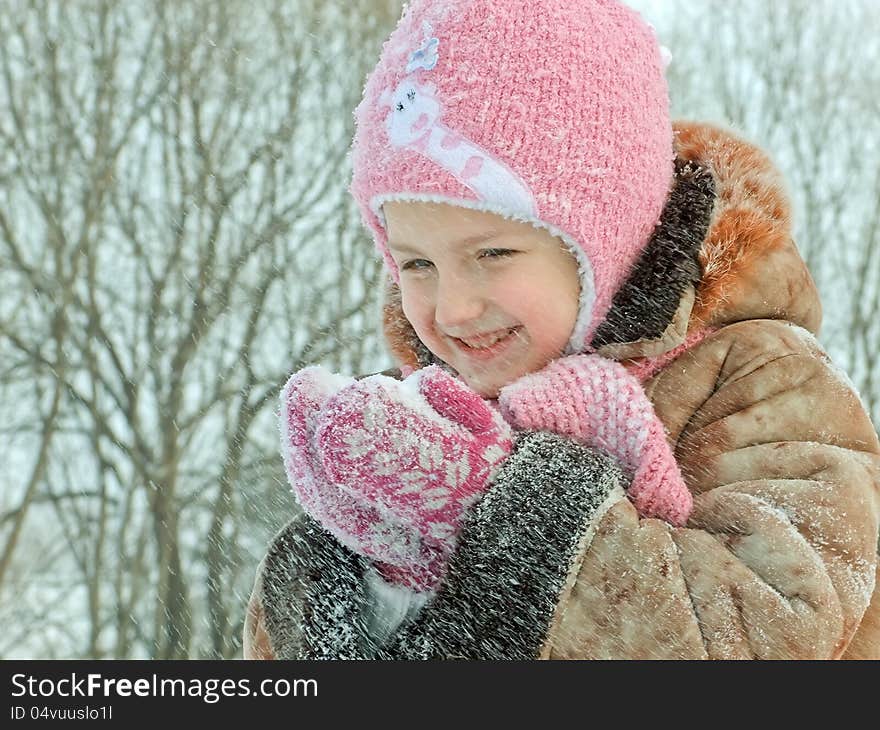 Sweet girl with snow in hands. Sweet girl with snow in hands