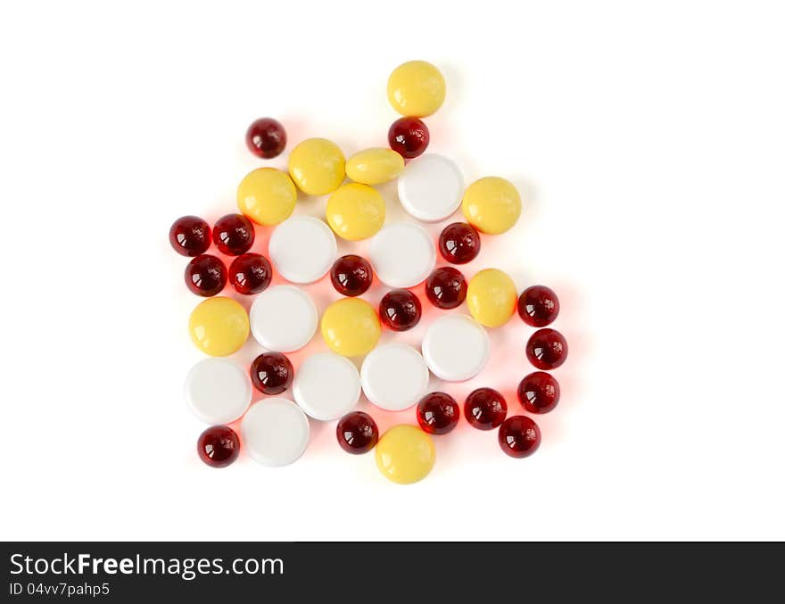 Colored pills on a white background