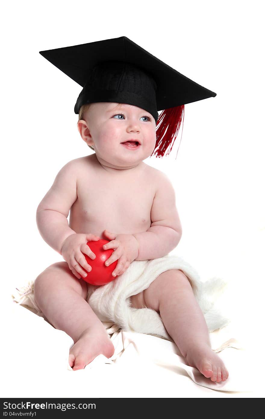 Emma with graduation hat and red ball