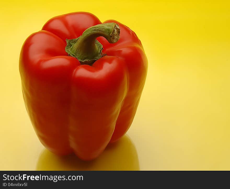 Red bell peppers on yellow kitchen counter