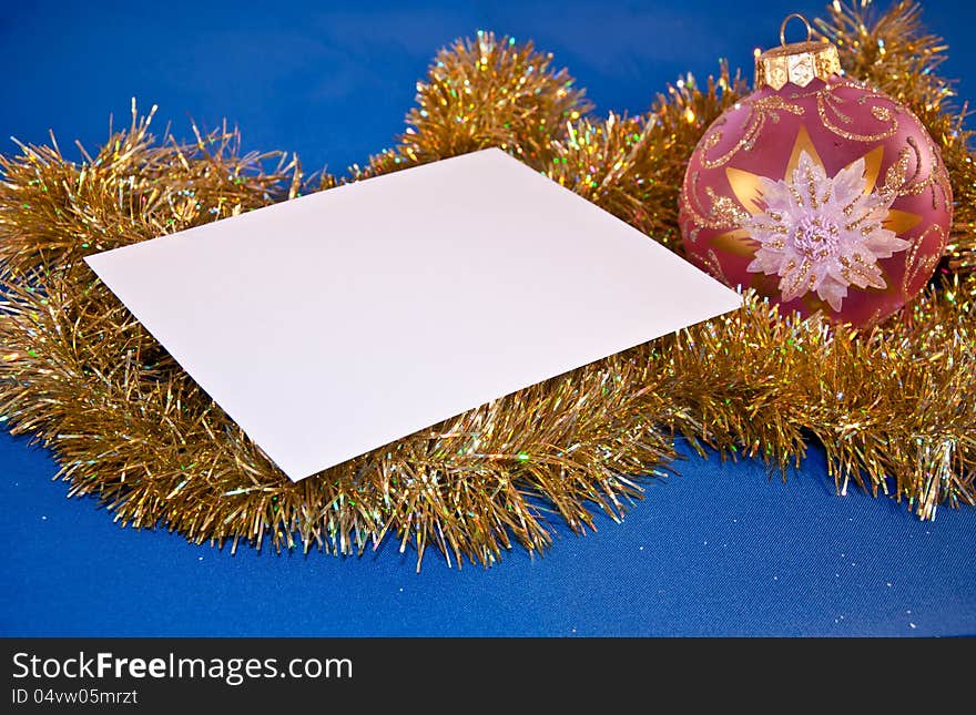 Christmas card with a sphere and tinsel