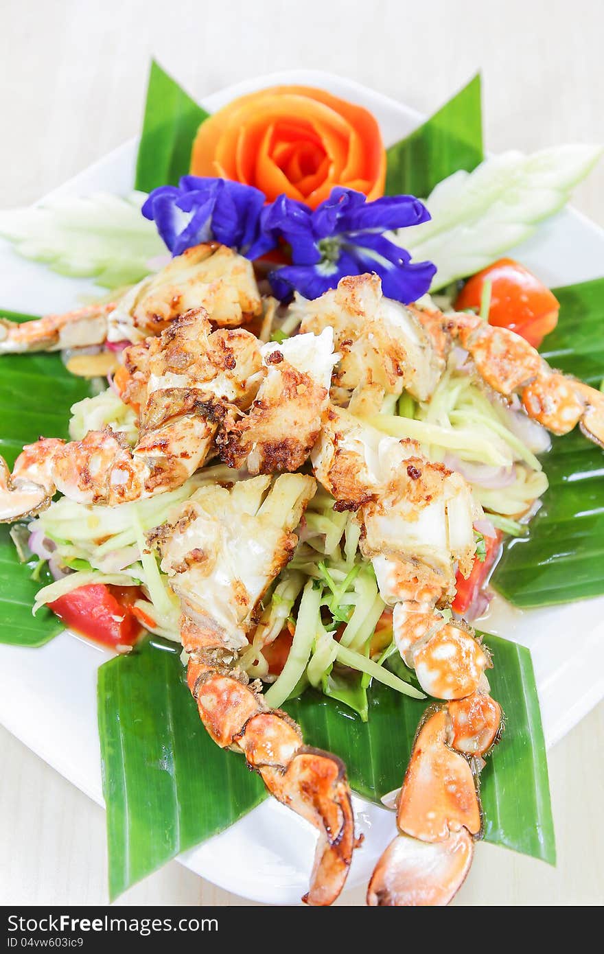 Thai seafood, crap salad with flowers decoration