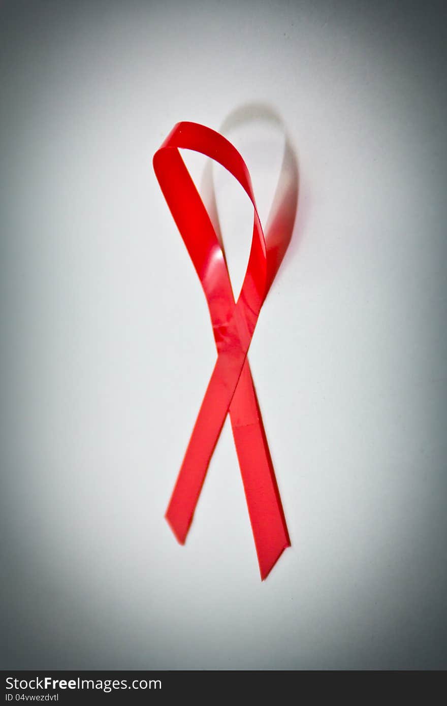 A Red Ribbon signifying support for AIDS/HIV awareness. A Red Ribbon signifying support for AIDS/HIV awareness