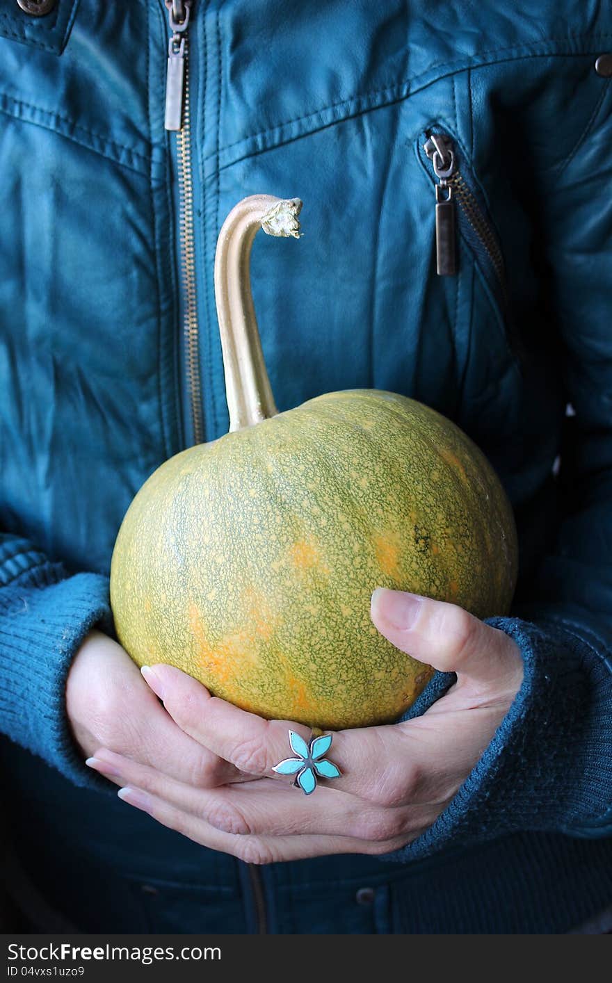 Woman Holding A Pumpkin