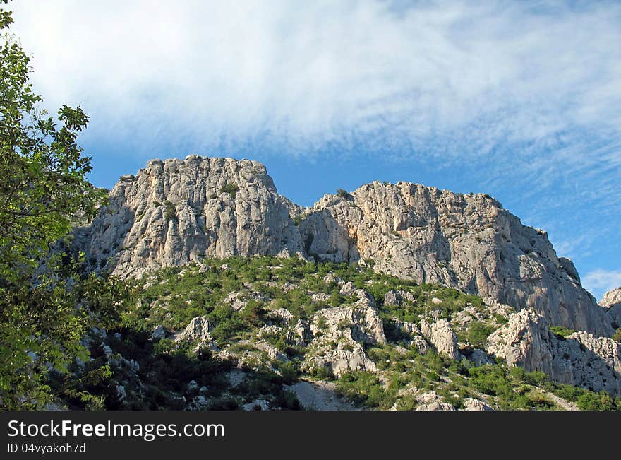 The Mountain tops in Horvatii on background sky. The Mountain tops in Horvatii on background sky.