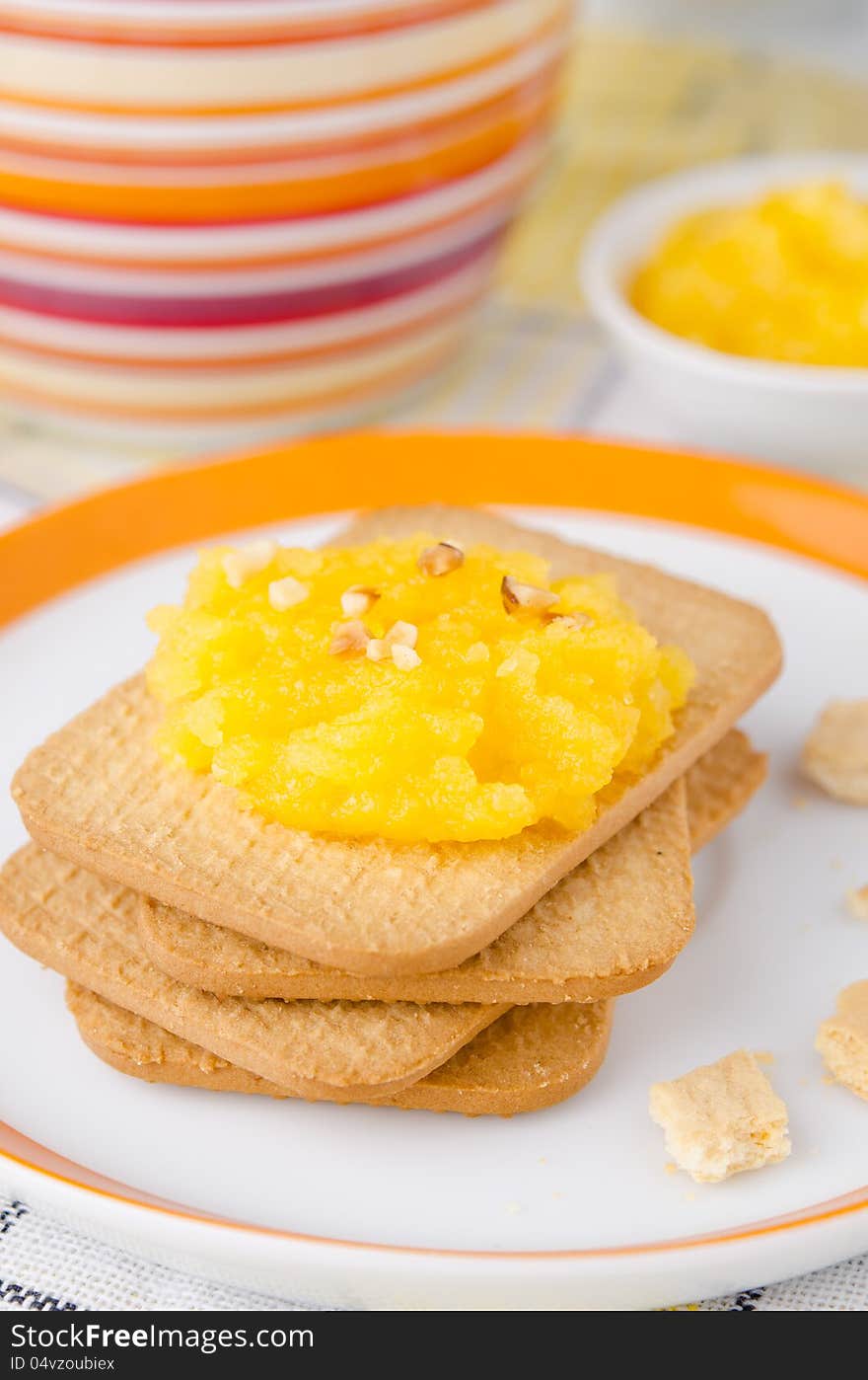 Breakfast - biscuits with orange marmalade and coffee with milk. Breakfast - biscuits with orange marmalade and coffee with milk