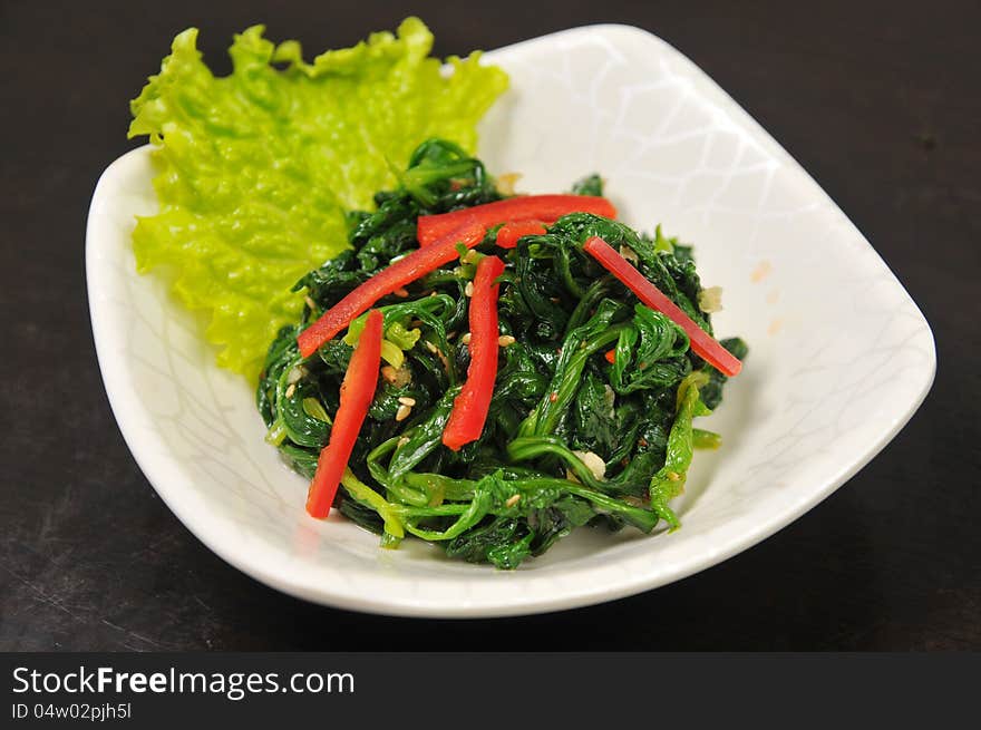 Chinese appetizers, TSpinach and red pepper. Chinese appetizers, TSpinach and red pepper