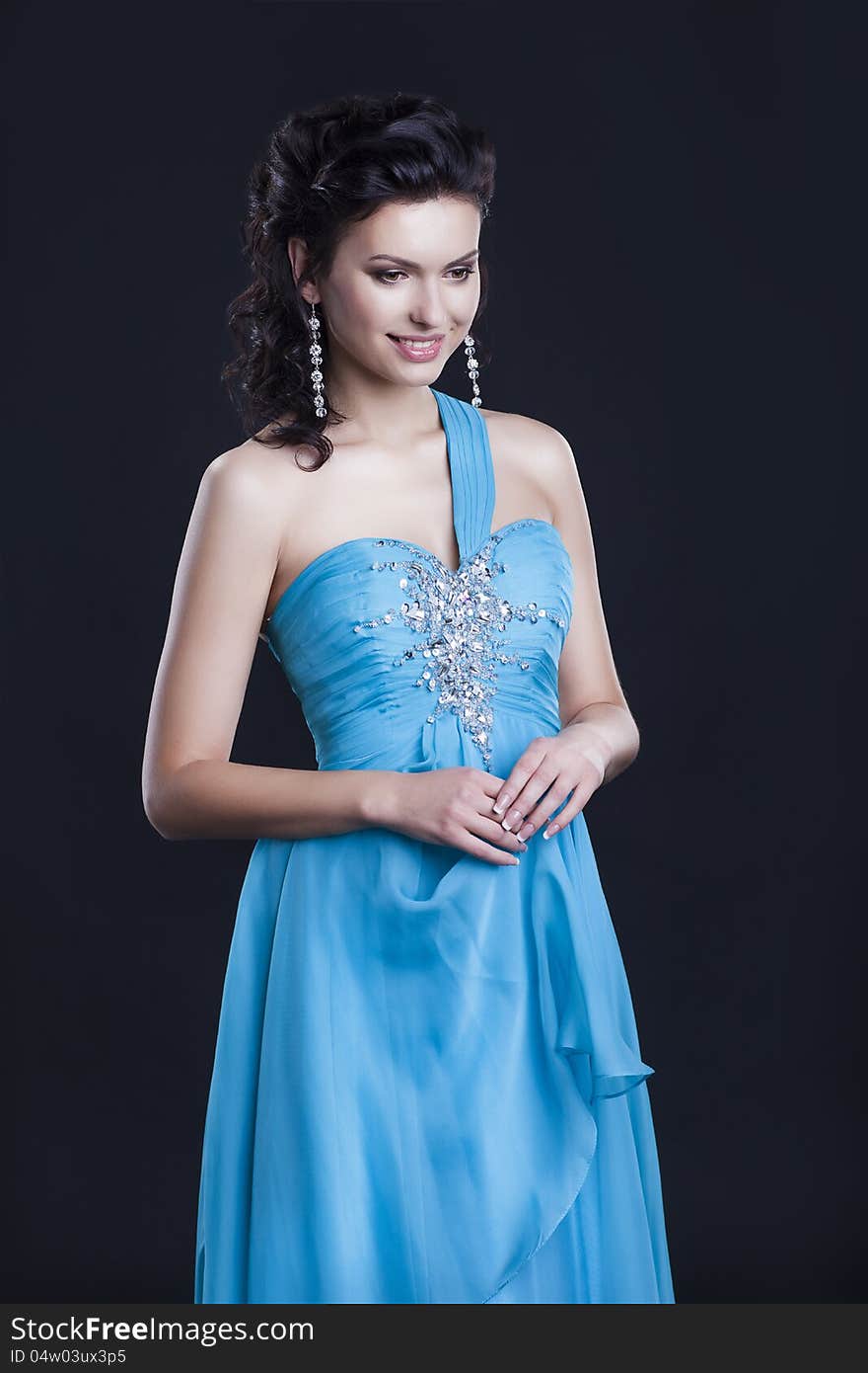 Beauty young female in fashionable vogue blue dress. Beauty young female in fashionable vogue blue dress