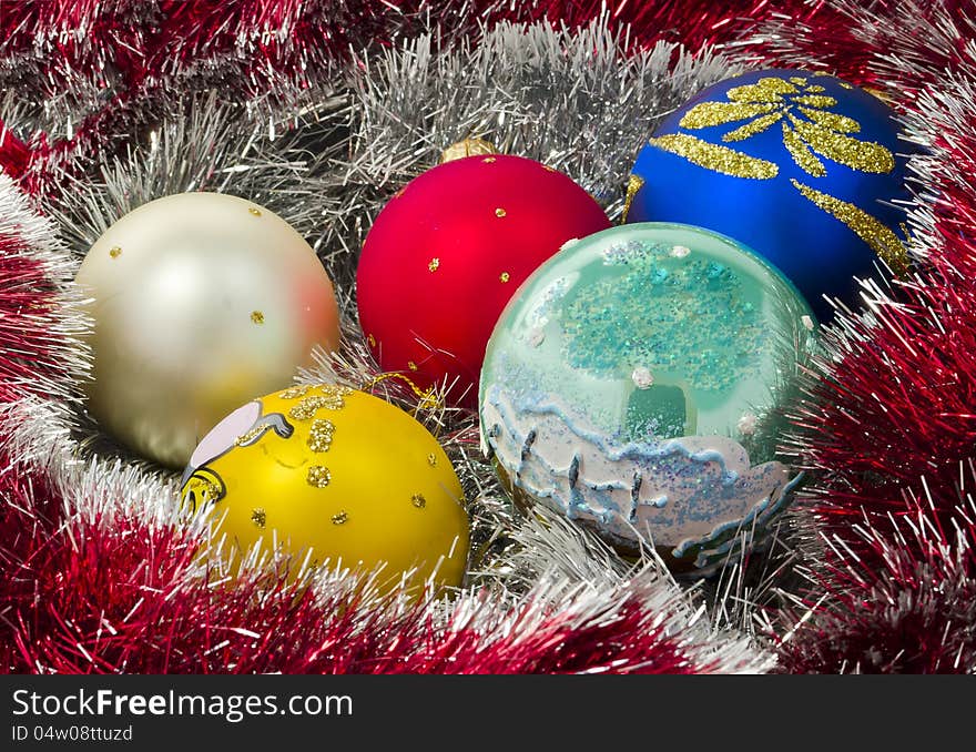 Garland and colored balls over white