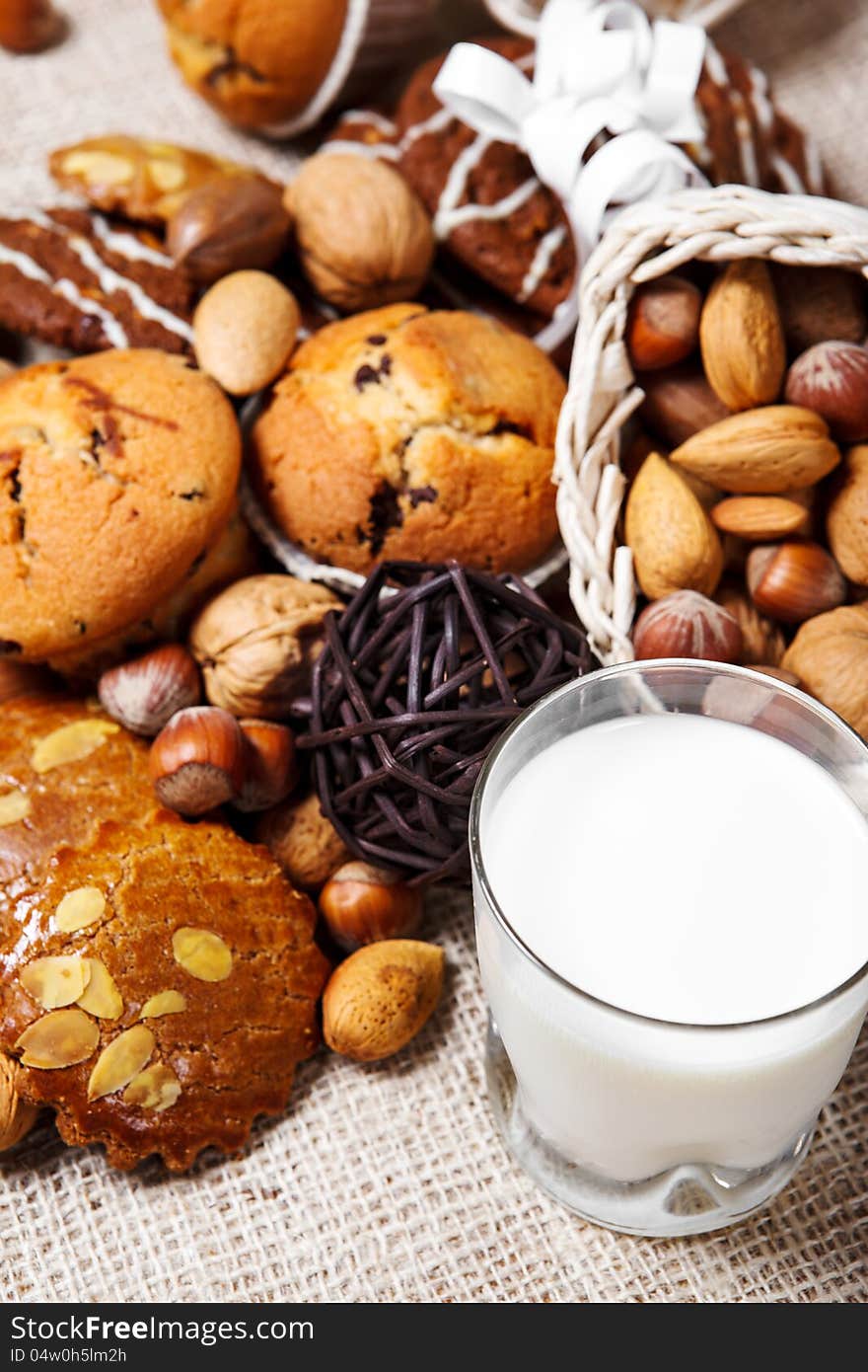 Homemade pastry, nuts and glass with milk