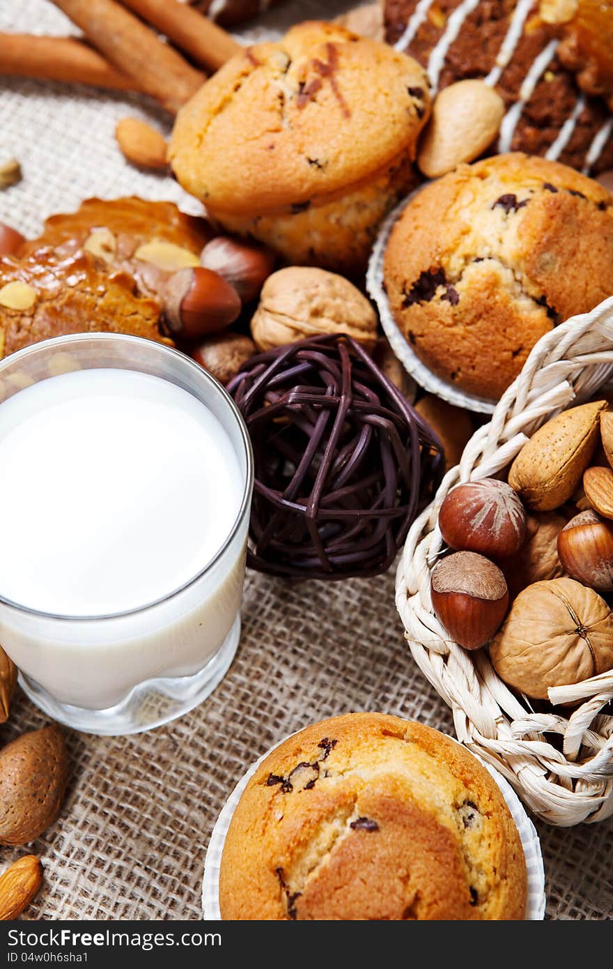 Delicious fresh baked muffins, milk and nuts. Delicious fresh baked muffins, milk and nuts