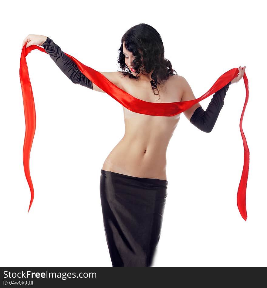 Photo attracting woman in exotic dress with red ribbon, posing in studio on white background. Photo attracting woman in exotic dress with red ribbon, posing in studio on white background