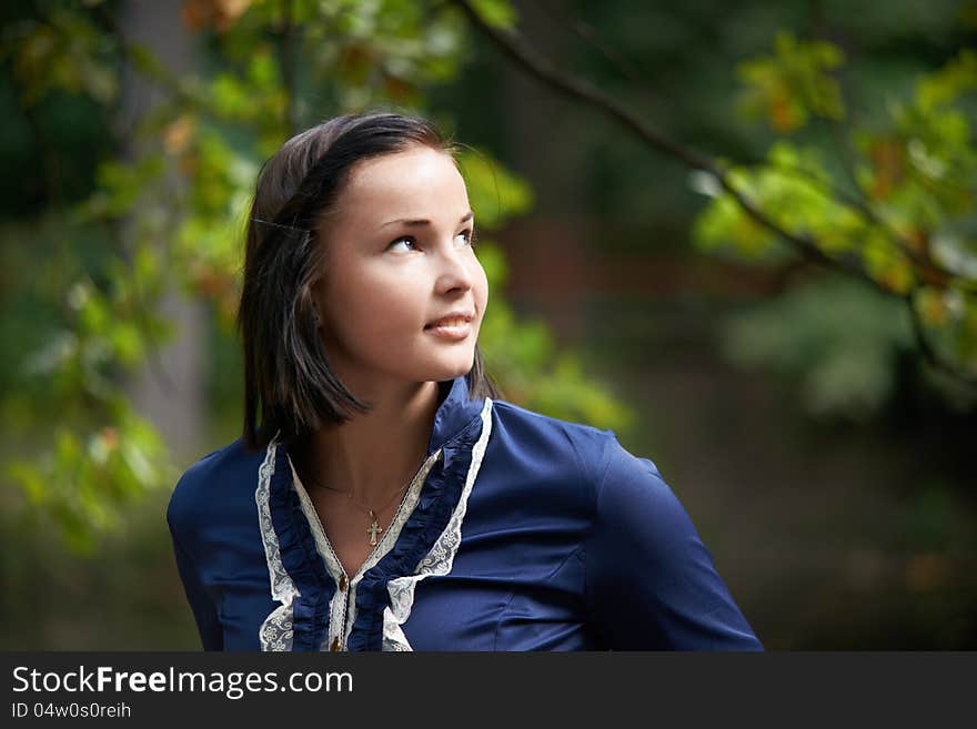 Romantic young woman in a summer park