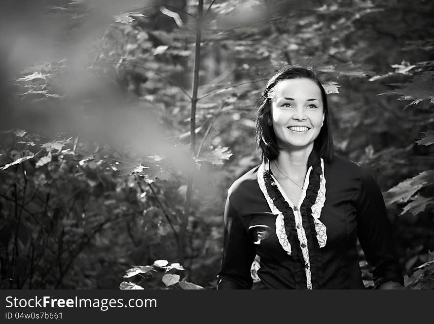 Cheerful young woman in a summer park