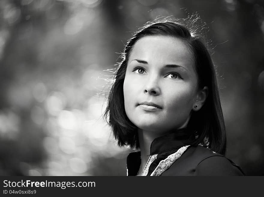 Romantic young woman in a summer park