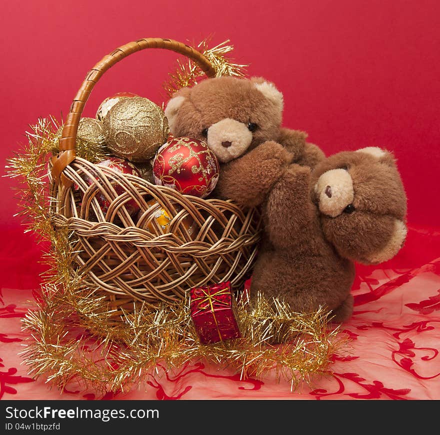 Teddy Bears and a basket with Christmas toys. Teddy Bears and a basket with Christmas toys.