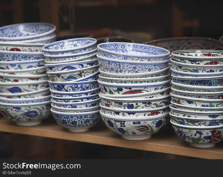 Traditional turkish souvenir bowls on a shelf. Traditional turkish souvenir bowls on a shelf