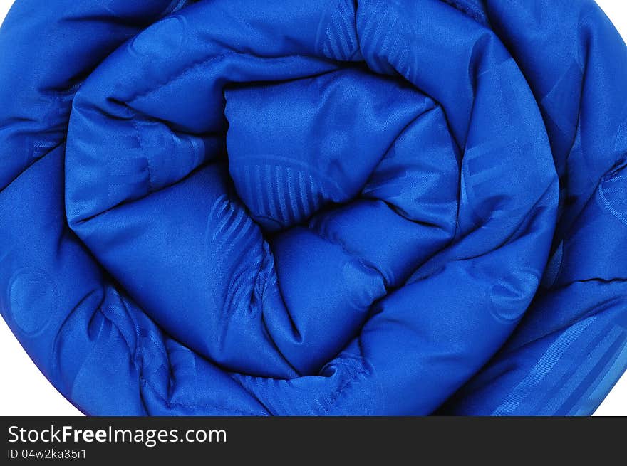 Close up of a rolled up comforter. Close up of a rolled up comforter.