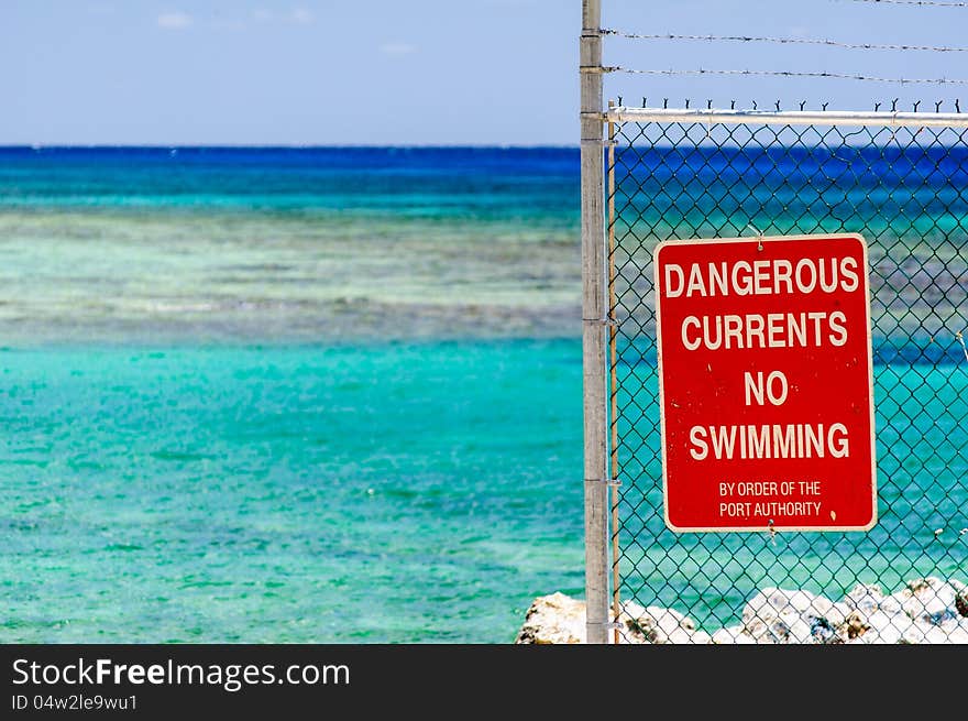 Dangerous currents sign no swimming