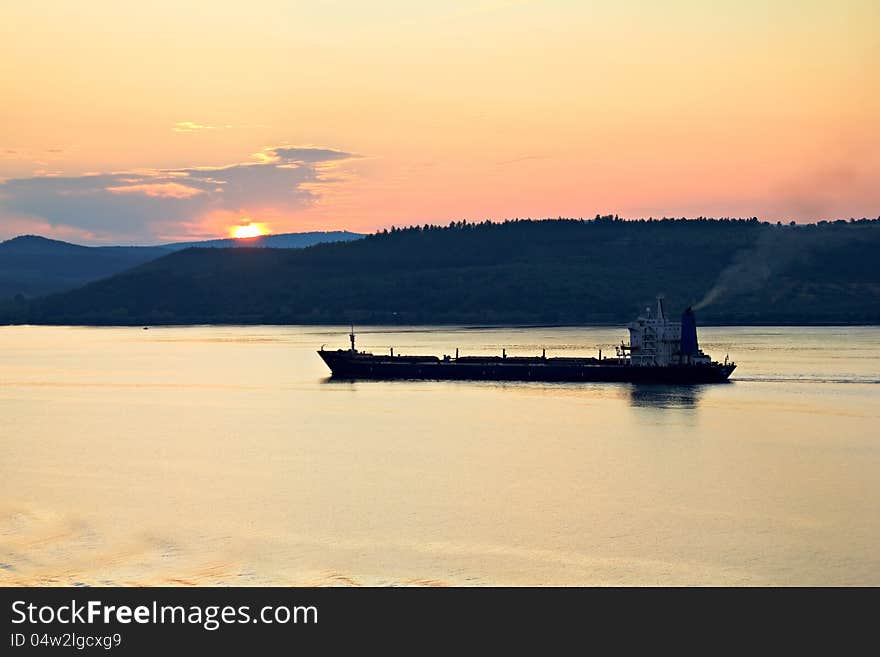 Cargo ship at sunset