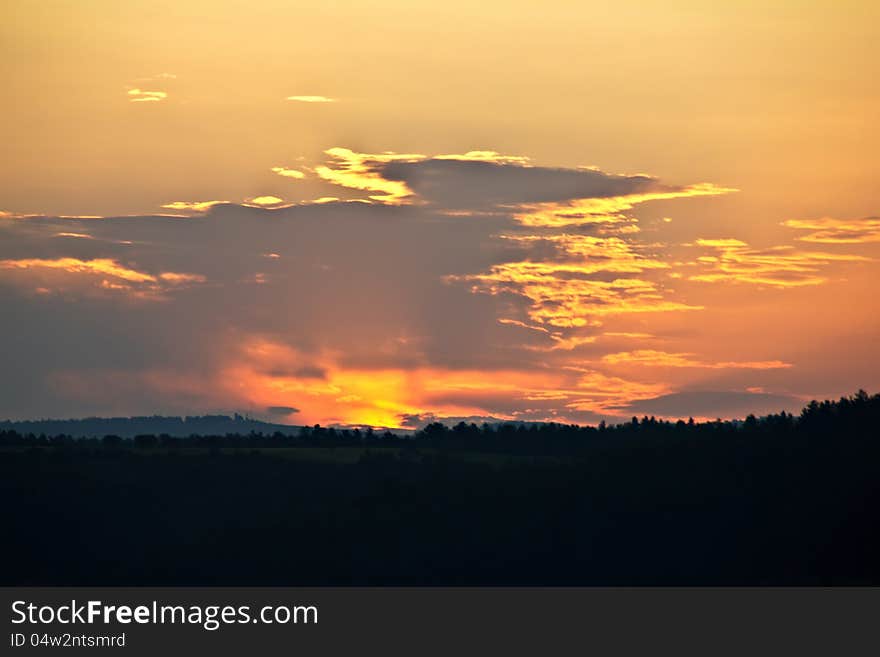 Orange beautiful sunset over the hills. Orange beautiful sunset over the hills