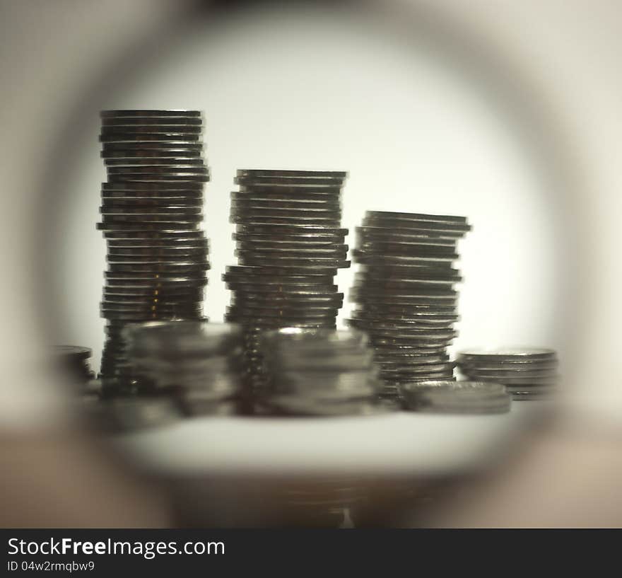 Stack of coins photographed through a magnifier