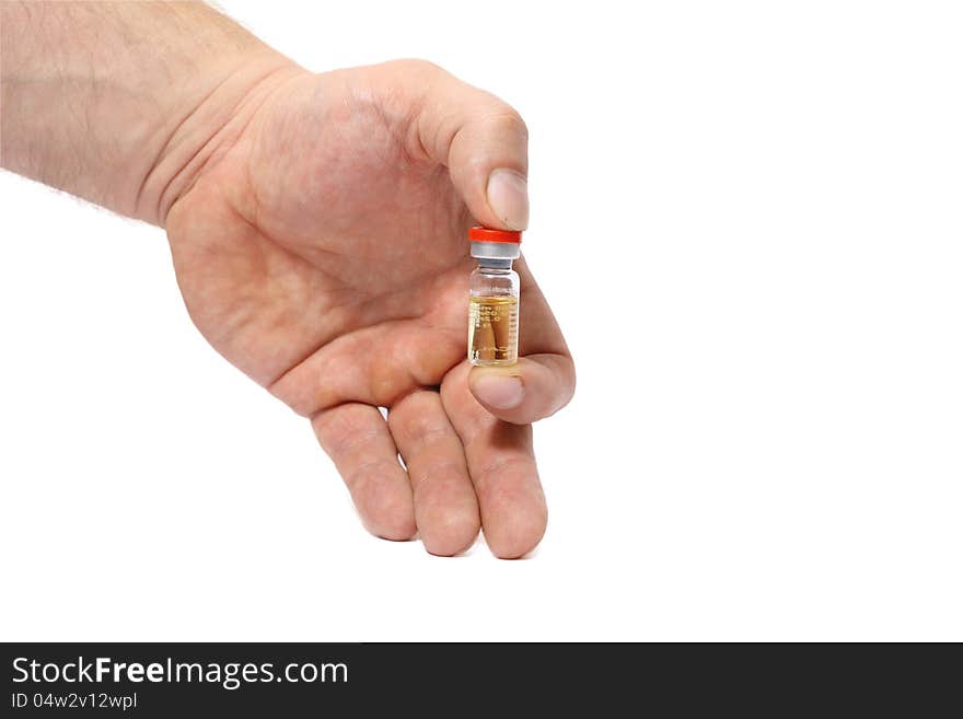 Ampoule in a hand  on white background.