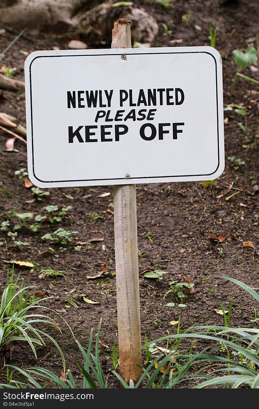 Warning sign to stay away from planted areas. Warning sign to stay away from planted areas