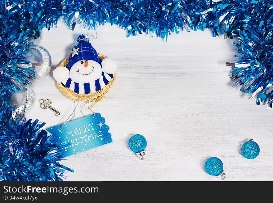 Christmas decoration with different decorative elements in blue colors on rusty white background. Christmas decoration with different decorative elements in blue colors on rusty white background