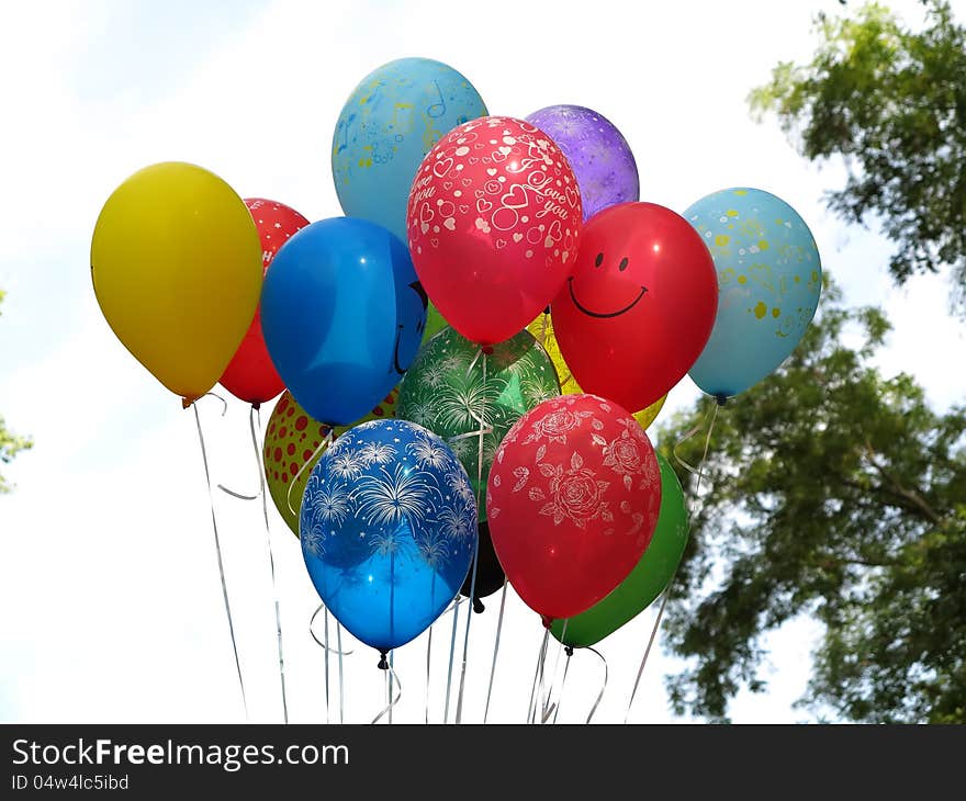 Flying colorfull balloons over blue sky