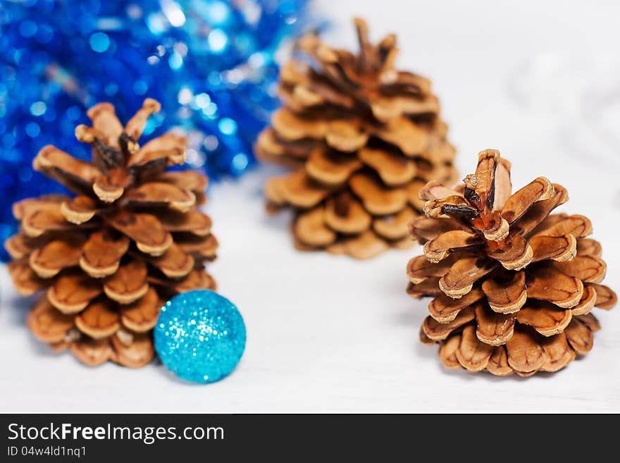 Christmas decoration with three cones and blue glitter balls. Christmas decoration with three cones and blue glitter balls