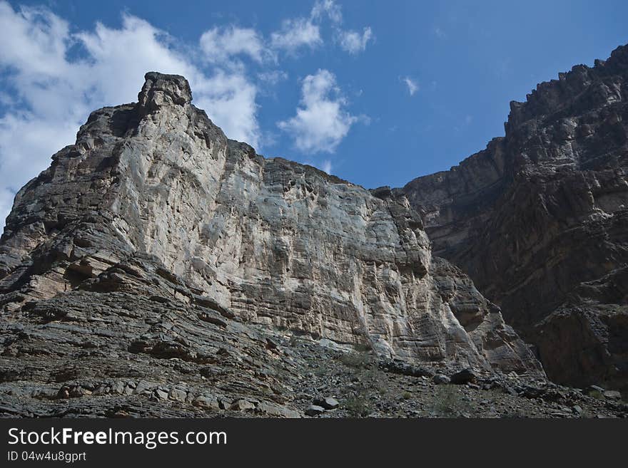 View from the interior of Wadi An Nakhur, Oman, featuring the rocky sides of the Gorge. View from the interior of Wadi An Nakhur, Oman, featuring the rocky sides of the Gorge.