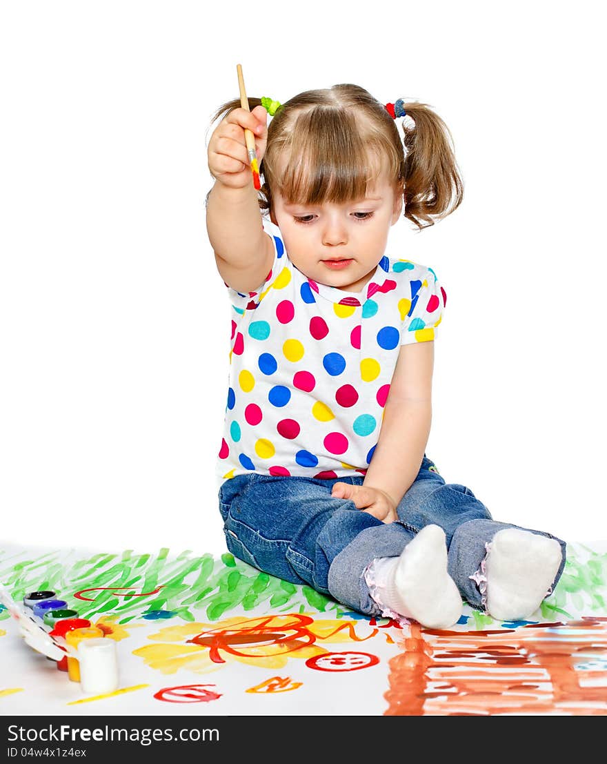 Portrait of a young girl which draws paint sitting on the floor. Portrait of a young girl which draws paint sitting on the floor