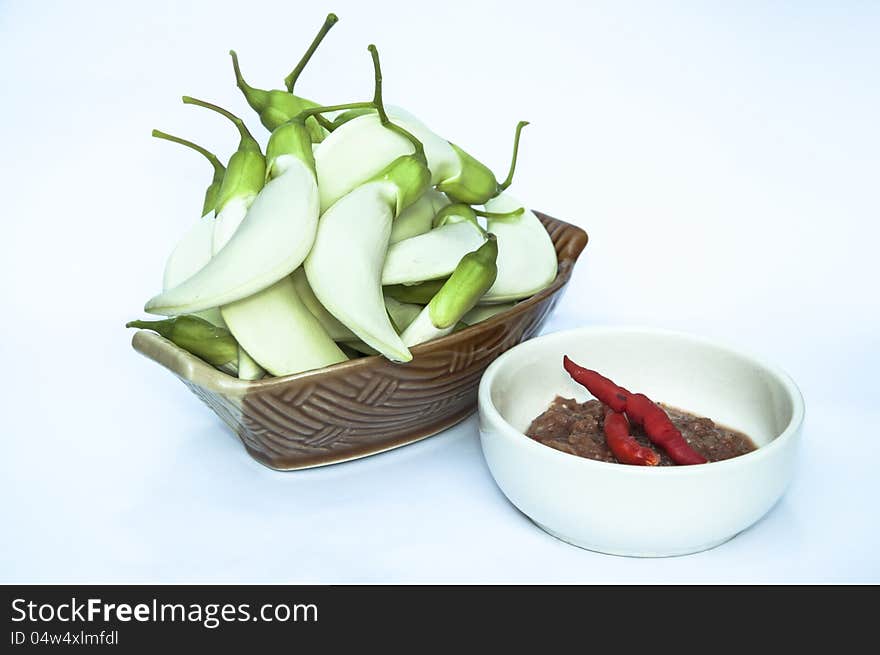 Vegetables in ceramic bowl and Spicy Chili Paste.