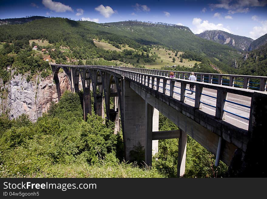 The Djurdjevica Tara bridge, connects two rocky sides of deep Tara's river canyon, Montenegro. The Djurdjevica Tara bridge, connects two rocky sides of deep Tara's river canyon, Montenegro.