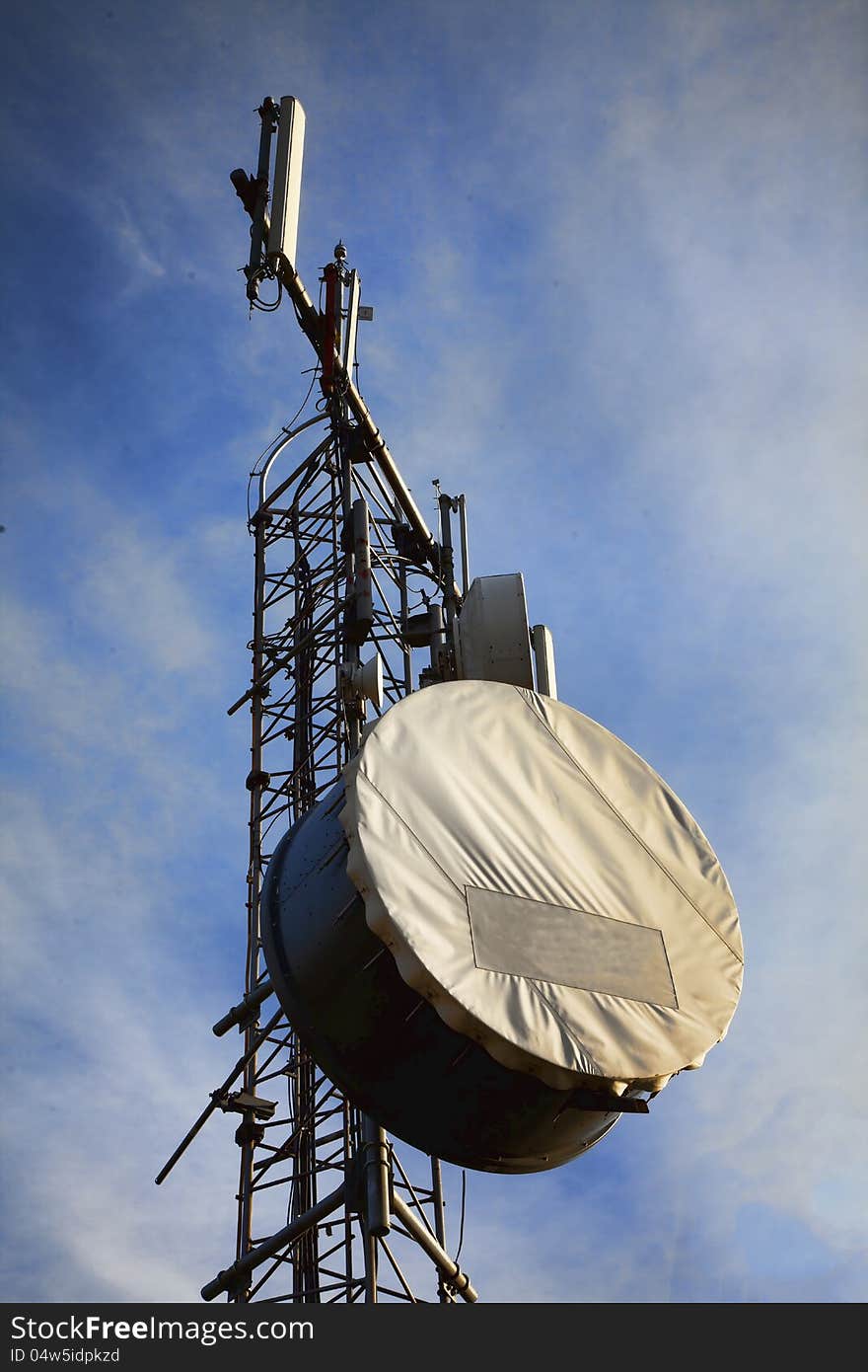 Telecommunication tower with antennas on blue sky. Telecommunication tower with antennas on blue sky