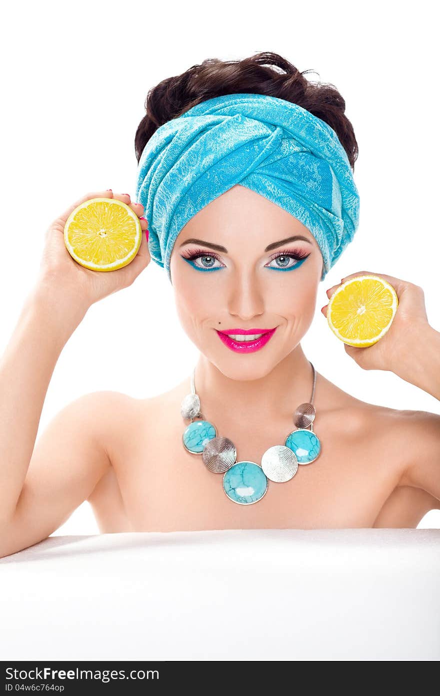 Smiling beautiful woman with fresh lemon - wholesome food concept. Smiling beautiful woman with fresh lemon - wholesome food concept