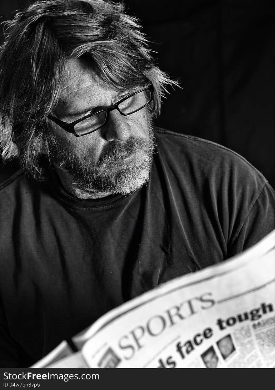 Man Reads Newspaper