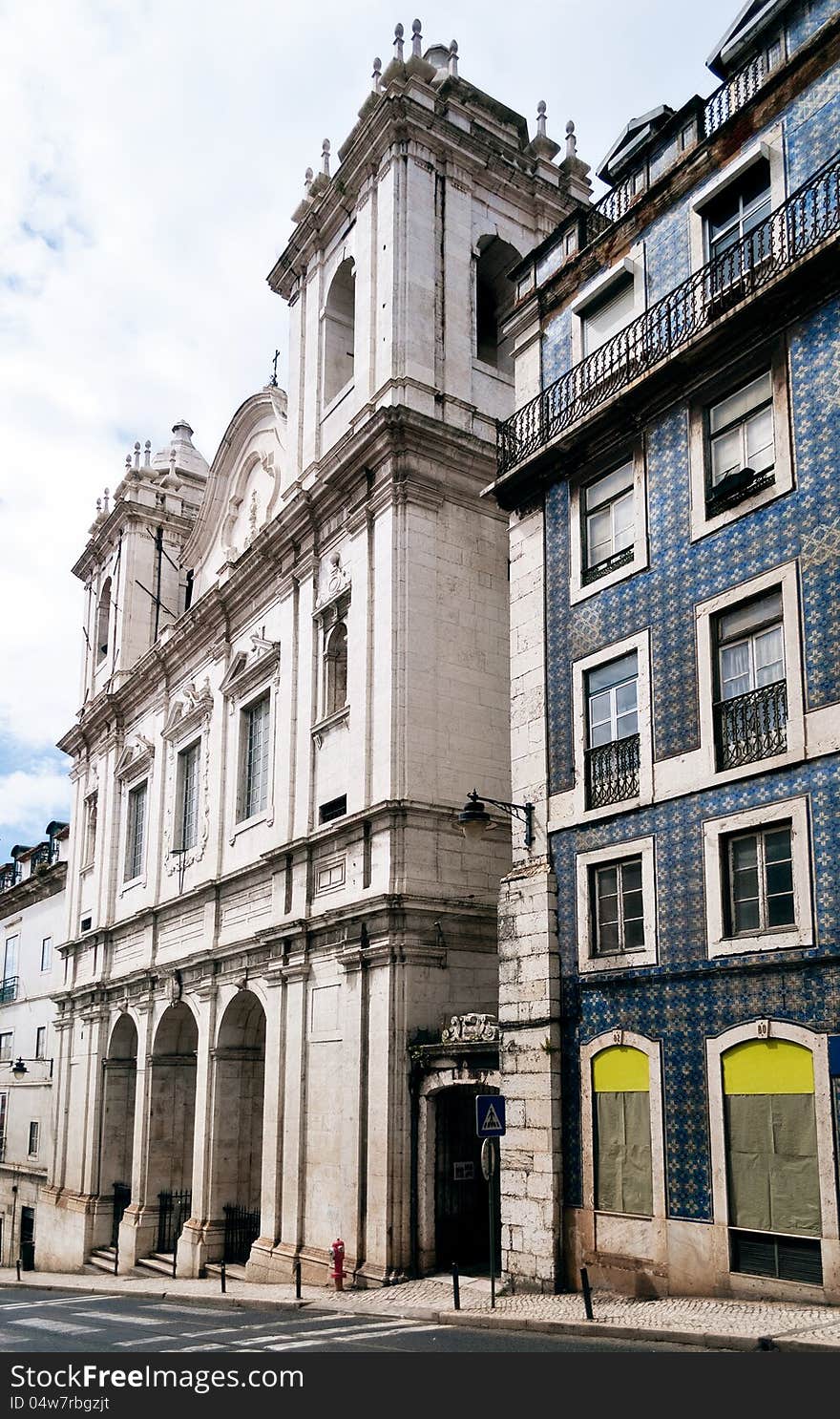 Church of Saint Catherine of Alexandria peeking from between the 18th Century buildings of the Santa Catarina quarter of Lisbon. Portugal. Church of Saint Catherine of Alexandria peeking from between the 18th Century buildings of the Santa Catarina quarter of Lisbon. Portugal