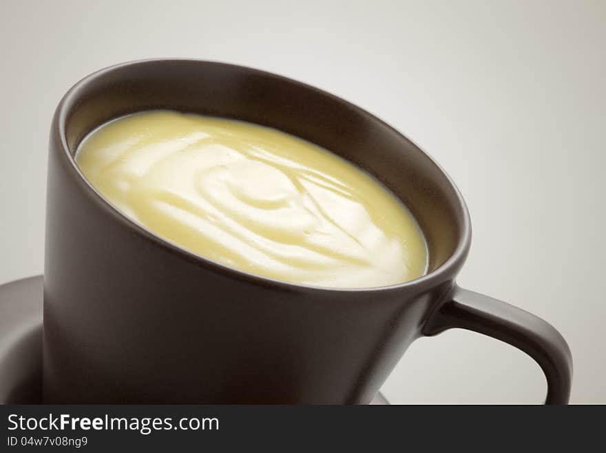 Cup of white chocolate, close up