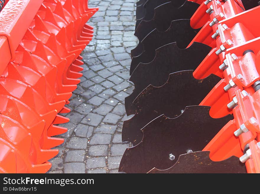 Red and black giant farming plough