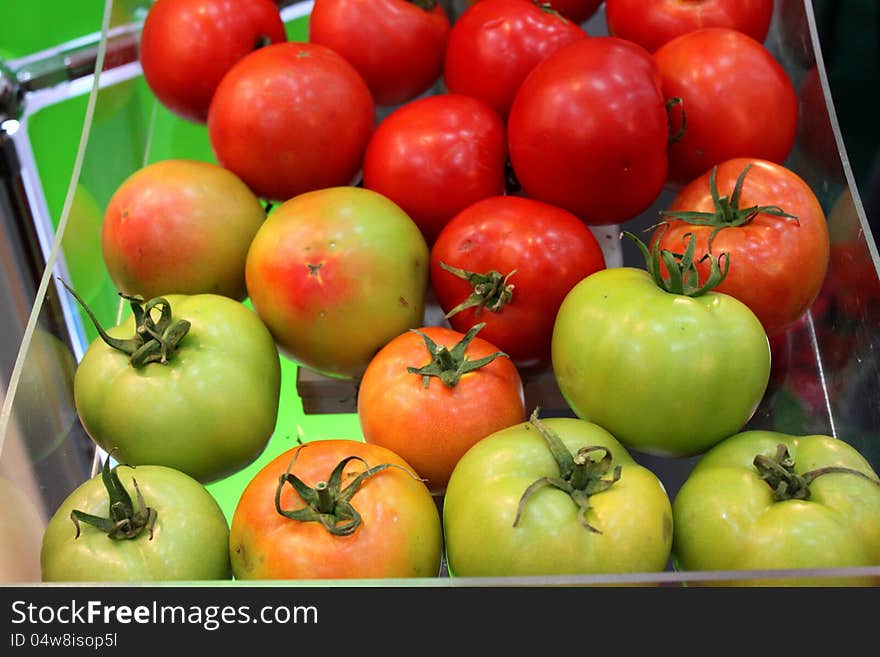 A lot of tomatoes exposed and lighted