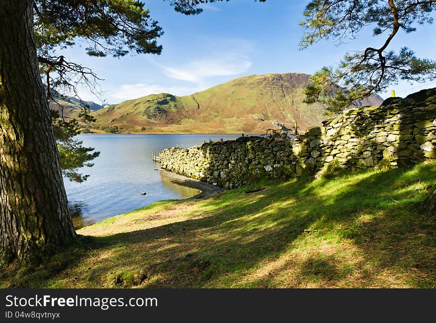 Stone wall into Crummock Water