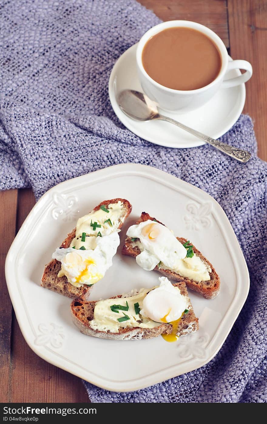 Breakfast with rye bread sandwiches, quail eggs and french cheese. Breakfast with rye bread sandwiches, quail eggs and french cheese