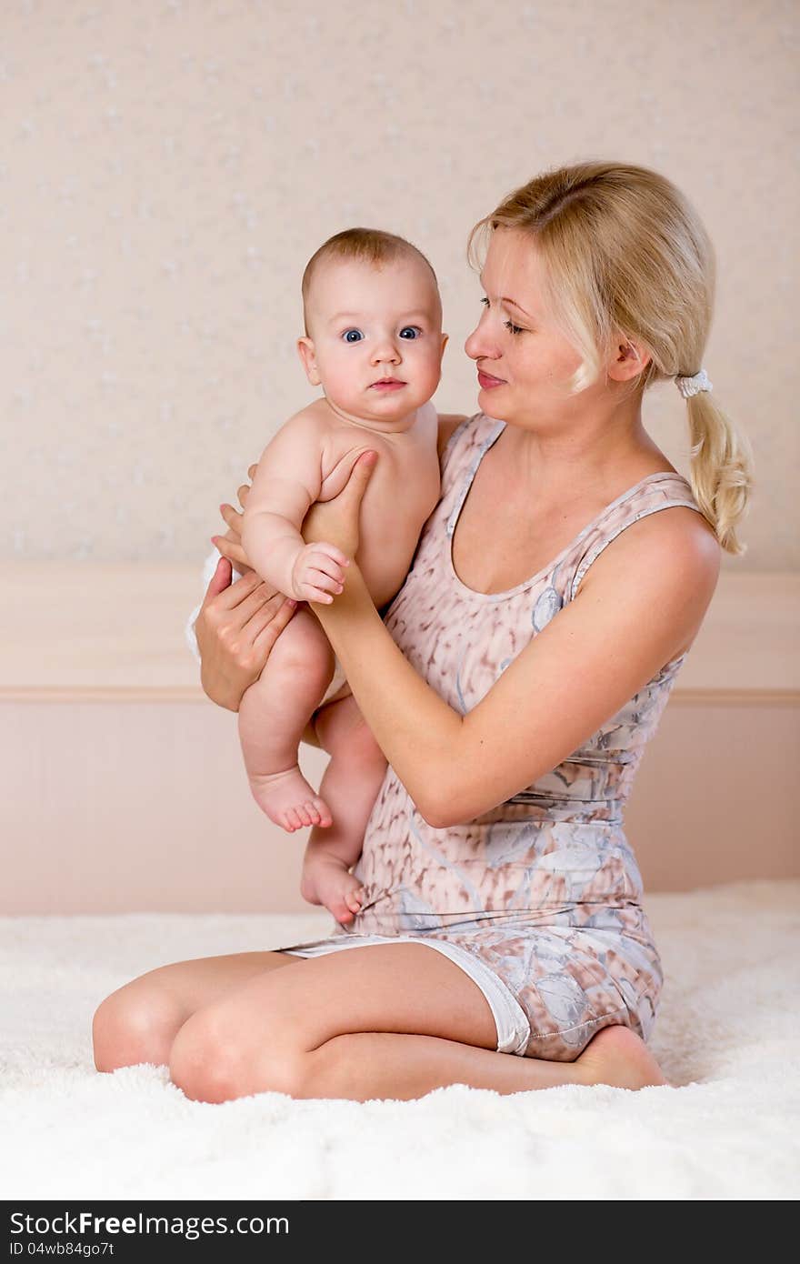 Loving mother holding baby boy