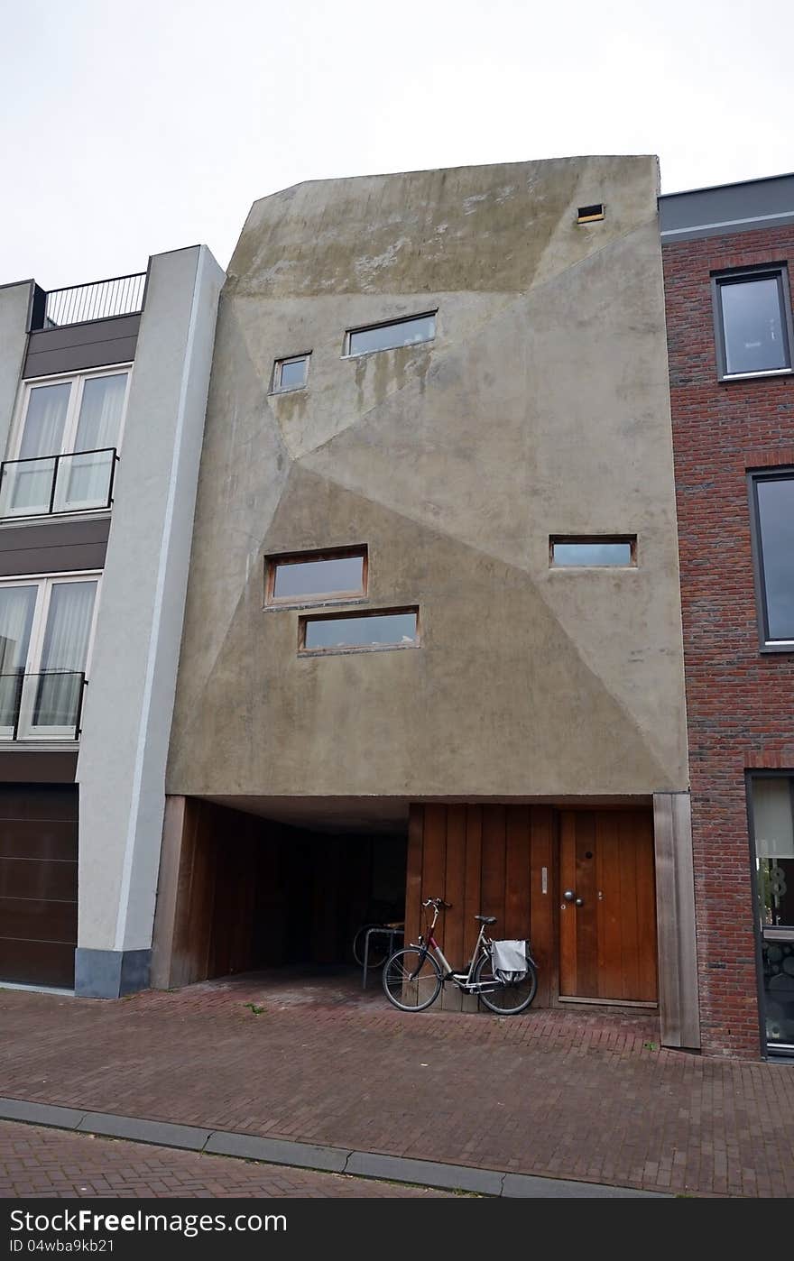 This image presents a modern, yet strange facade of a building from Amsterdam. This image presents a modern, yet strange facade of a building from Amsterdam